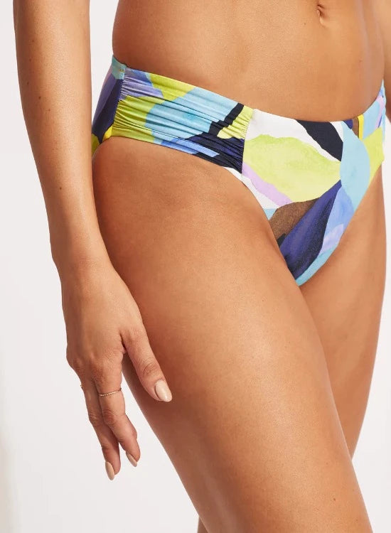 Be daring, be brave and be beautiful in Seafolly's Tropfest pattern. This fun tropical design will ensure you stand out from the crowd at your next cabana. Top features removable soft cups, adjustable multifit straps and ruched center detail.Bottoms are a classic retro cut bikini pant with side ruching detail.