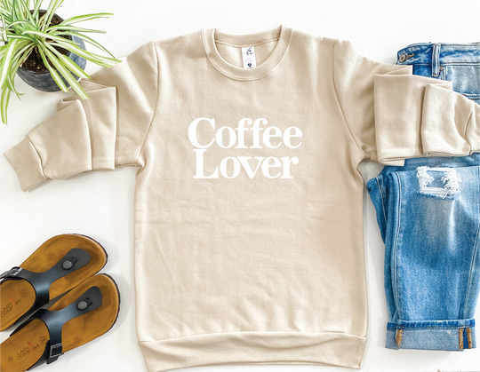 Treat yourself to coffee-lover comfort and style with the Signature Coffee Lover Crewneck Sweater! This oversized, fuzzy-lined sweater has all the makings of a comfy classic - featuring a 50/50 cotton-polyester blend, all you have to do is order to true size and enjoy! It's time to get cozy!