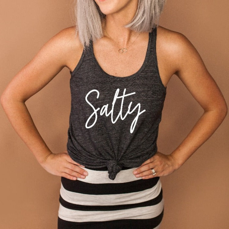 Our Flowy Racer Back Tanks are EVERYTHING!!! No matter what your plans are, from snoozing on the sofa to strutting down the street, this tank is sure to give you a look that will turn heads and keep you feeling comfy all day long. Perfectly draped for maximum flow and featuring a racerback style, this tank top is fitted (but not too fitted!) in the bust - just right for your everyday wear.