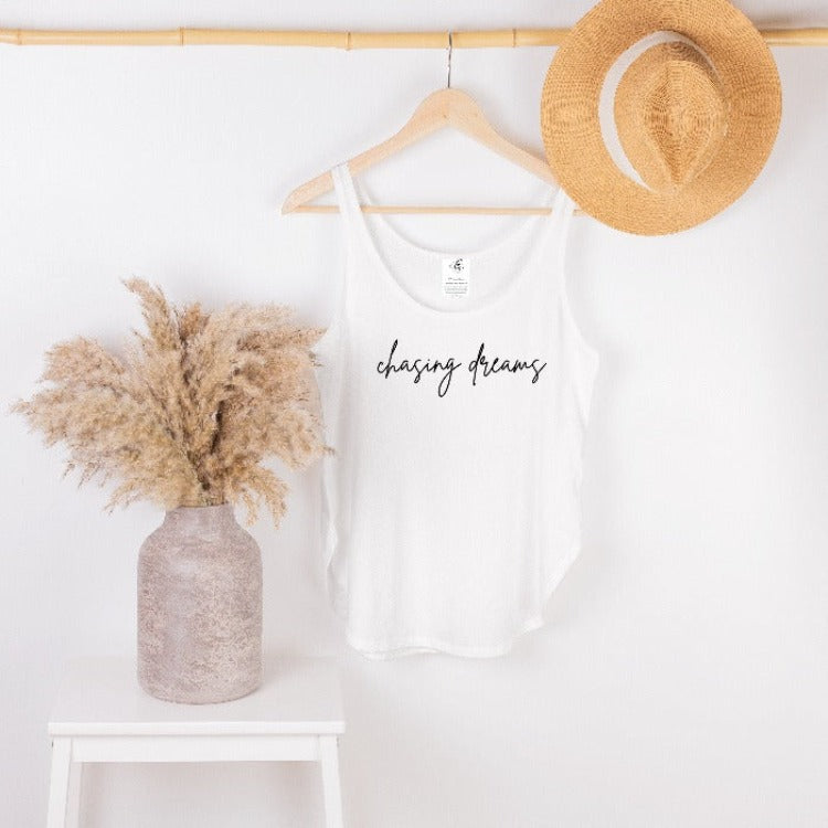 Our Chasing Dreams Sunkissed Tank Top is your perfect summer companion - chillax in its comfy relaxed fit, show off the curved hem and side slits, and soak up all that sweet summer sunshine! Who needs beaches when you have this tank? #goals!