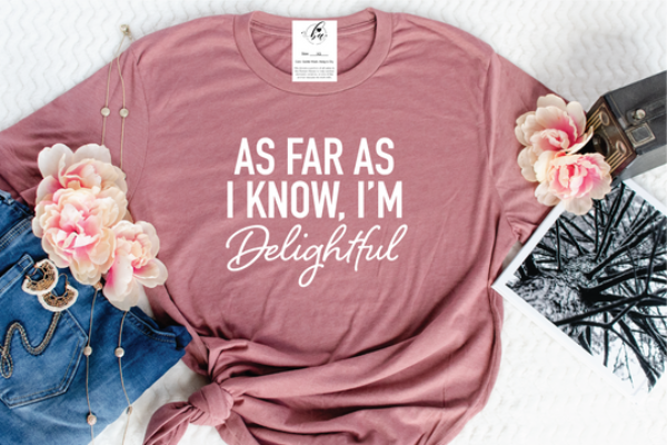Make a statement with Blonde Ambition's "As Far As I Know I'm Delightful" Tee! Guaranteed to turn heads and keep 'em turning, this Alberta-designed tee is made for maximum comfort and maximum style. And don't worry, it's not just a figure of speech - it's 100% DELIGHTFUL!