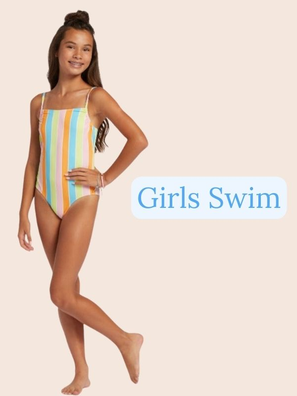Girl wearing a blue two piece bathing suit with flowers on it