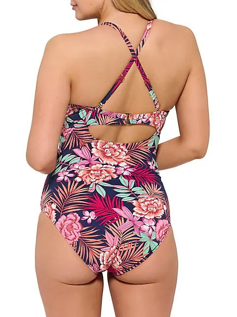 The Christina Bungalow Rose D Cup Crossover One Piece is your instant getaway! With a tropical print, a flattering low plunging neckline, adjustable straps, and a built-in bust enhancer, this 'Barbie-esque' one piece is your ticket to a beautiful beach day. Get ready to shape, sculpt, and stun in this summer style stunner!