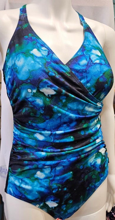 A water-color dream. Tide pool-inspired aquarelle in bubbles and kelp. Wrap front, multifit shelf bra, adjustable straps. Side ruching, tummy control. Full back and lower leg line. 100% polyester for chlorinated environments. Aquashield lining and exterior. Soft cup, hook & eye clasp. Y back option.