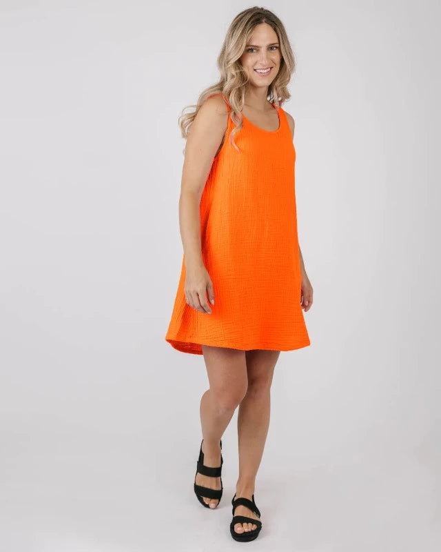 Dress to impress this season with our Nancy Tank Dress! This stylish tee dress features a tank style top and side pockets for added convenience. Show off your summer style and don't forget to bring your essentials! Everything you need, all in one dress.      5067