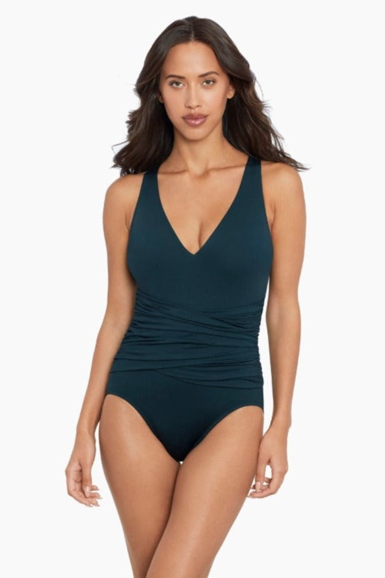 Plot Twist Stun in the Valerie One Piece Swimsuit from Magicsuit Swimwear! A sizzling mix of gorgeous solids and chic control and support will have you looking and feeling like a million bucks—confidently stylish from all angles. Plus, its wireless bra support and removable soft cup padding means it can accommodate up to a D-cup, giving you comfort and coverage. One Piece Swimsuit  Style: 6006094