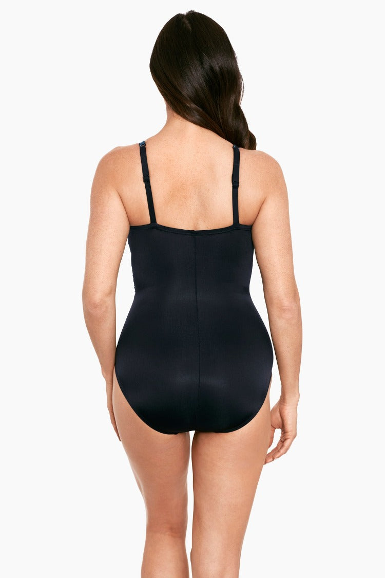 Wrap yourself in pure magic with the Miraclesuit Titania Mystique One Piece! This stunning swimsuit—with its foam cup and underwire for extra support, sweetheart neckline, and adjustable lingerie straps—offers a unique fit to emphasize your beautiful shape. And you'll love the way it makes you look 10 lbs. lighter in 10 seconds! Not to mention the mesh insets and moderate leg cut for streamlined curves and long-lasting LYCRA® XTRA LIFE™ Spandex fabric—this suit is sure to make a splash!