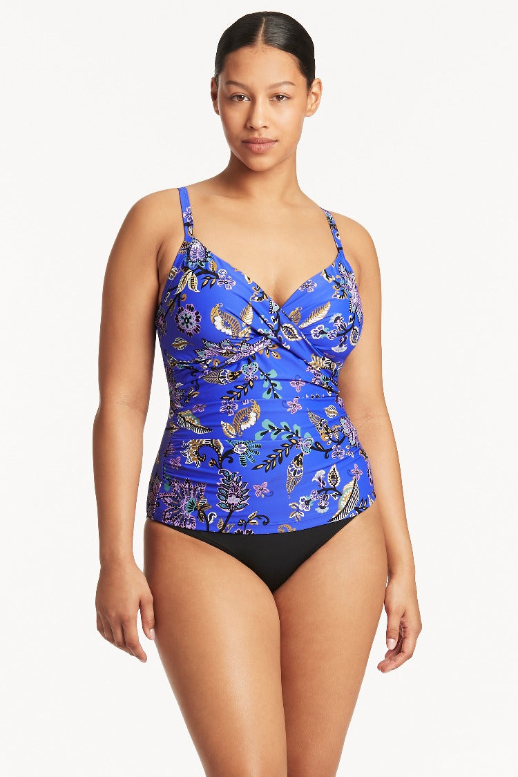 Be beach-body ready with the Carnivale DD/E Cup Tankini! Whether you’ve got a DD or E cup, we’ve got your back with our underwire bra sheath and removable soft cups. Plus, the adjustable and convertible straps provide the perfect fit. No wardrobe malfunctions here! With side boning for shape, powermesh lining for superior support, and an adjustable, fold-down waistband, you’ll be hitting the beach in style!