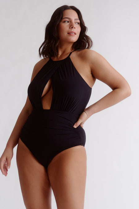 Feel like a Grecian goddess at the beach in this classic one-piece! A chic draped design and a chic high neckline combine to provide the perfect mix of style and sophistication. Plus, it offers cup support, inner support, tummy control, regular leg and regular coverage—it's the total package!