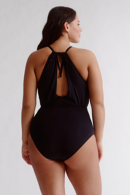 Feel like a Grecian goddess at the beach in this classic one-piece! A chic draped design and a chic high neckline combine to provide the perfect mix of style and sophistication. Plus, it offers cup support, inner support, tummy control, regular leg and regular coverage—it's the total package!