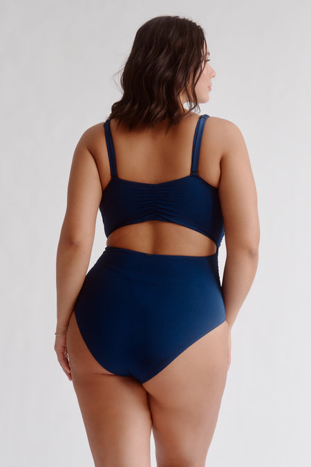 This alluring one-piece is a bodacious bodysuit that's bursting with beauty features: an attractive twisted style, gentle folds, and crafty cutouts. An classy must-have you'll be rockin' over and over, whether it's day or night. - Detachable cups - Inner support - Tummy taming - Semi high-leg - Mid coverage