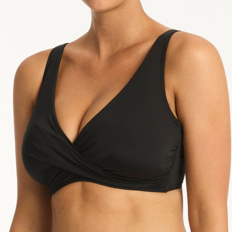 Discover superior support and style with the Eco Essentials Cross Front Bra. Expertly crafted with a hidden underwire bra and removable soft cups, your figure will be seamlessly sculpted while the adjustable straps and back E hooks guarantee a secure, comfortable fit for any cup size up to G. The heavy powermesh provides a body sculpting effect, allowing you to flaunt a silhouette that is as chic as it is supportive.     SL3324ECO