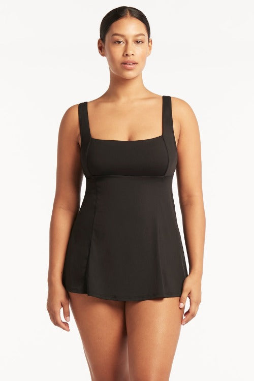 Take a dive into sustainability with the Sea Level Eco Essentials Square Neck Tummy Control Swim Dress! Crafted from advanced eco-friendly fabrics using regenerated nylon yarns, this swimsuit is sure to stay soft and durable every time you hit the beach. Plus, with hidden underwire bra, removable soft cups, adjustable & convertible straps, you'll have ultimate tummy control and support for a confident and stylish look! Dive right in!     SL1194ECO