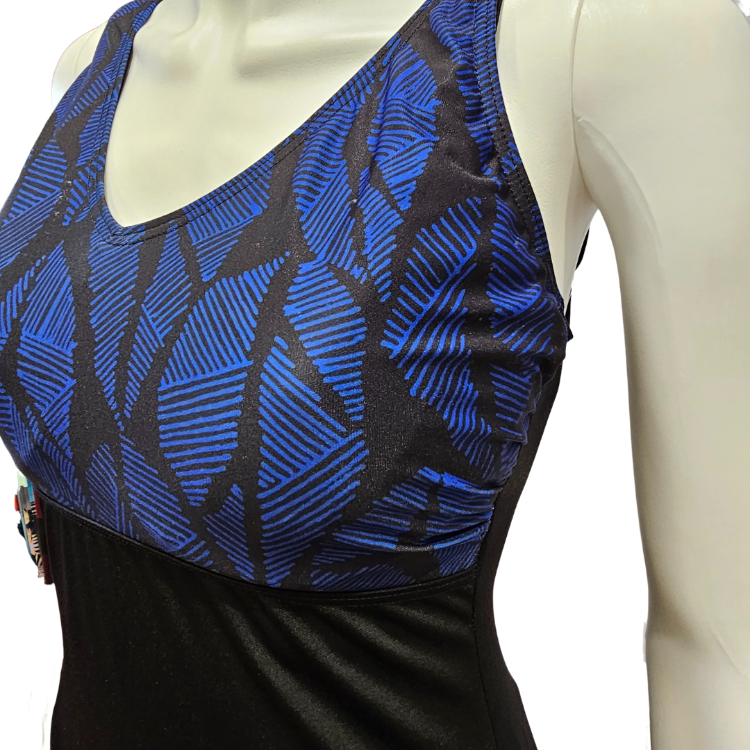 V-neck leaf print top w/ underwire E/F cup support. Black bottom double-lined for tummy control, scoop back & lower leg line. Built for lap swimmer, 100% Aqua-shield polyester won't break down. Adjustable straps & fashionable fun.