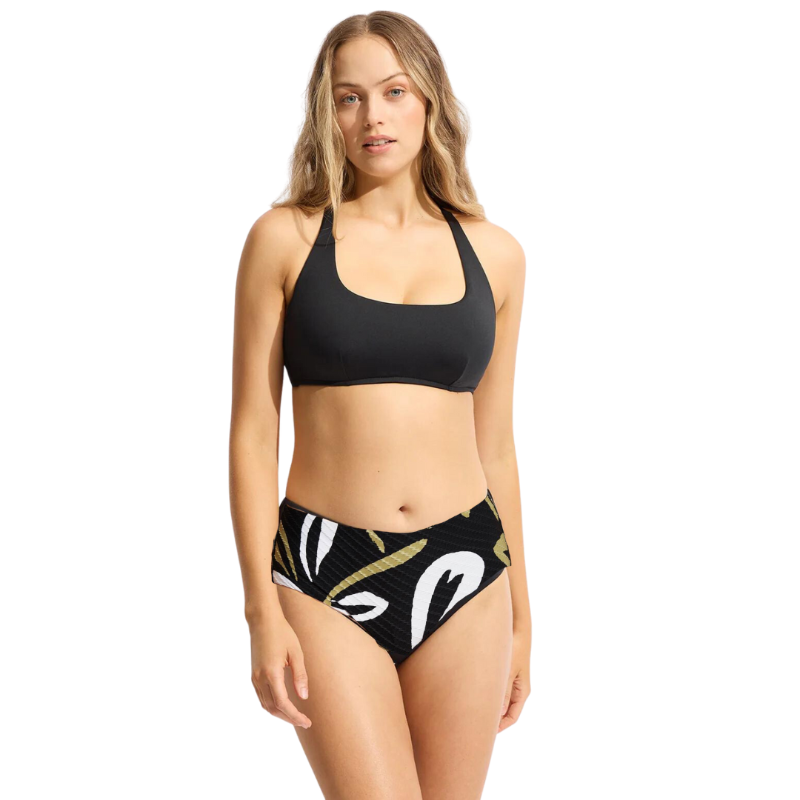 The Laguna DD Cup Bikini from Seafolly Collective is crafted with premium regenerated fiber fabric to provide timeless swim style with quality and comfort. Hidden underwire and side boning ensure optimal bust support, while adjustable and convertible straps allow for fit versatility and the perfect fit. Enjoy extra coverage with its low legline, aided by hidden mesh for excellent support. Effortless elegance for every woman and every-body.    31368DD942/40586