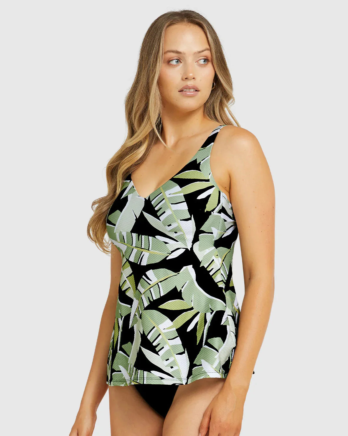 Splash your way into style with the Baku Canary Islands D-E Cup Tankini! This sophisticated two-piece set offers subtle tonal colors, abstract palm prints, and a daring dropped neckline with a V-shape, ensuring you look good without compromising on comfort. It comes complete with hidden wire, boning and shelf support for a larger bust. Now you can strut your stuff at the pool (or beach) with confidence!
