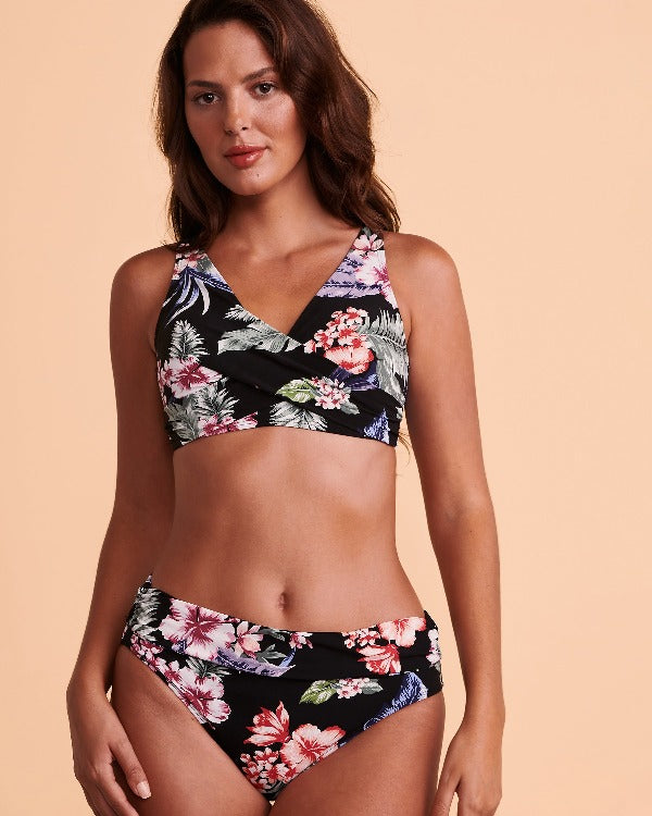 Make a splash on the beach in this cute Christina tropical print bikini! Dive into summer in this front wrap style top with adjustable straps and fixed cups. Transform your style with the bottoms that can be worn as a mid-waist or high, and enjoy moderate seat coverage for a balance of comfort and confidence. With the L clasp, you'll be looking beach-ready and ready-to-party all day! Photos by Bikini Village