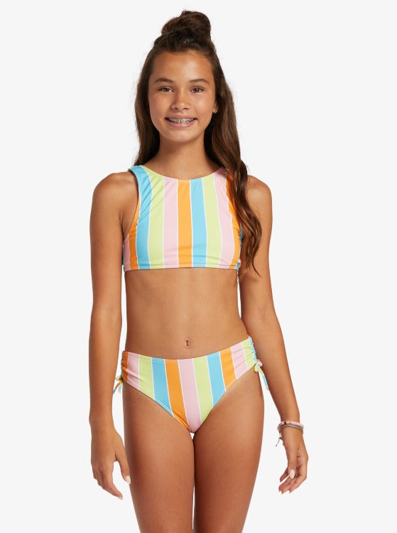 Ready to hit the beach or the pool? Our In Paradise Two Piece Crop Girls' Bikini will have your girl stand out from the crowd in the cutest way possible! Made with recycled and chlorine-resistant fabric, this cute bikini top is a pullover crop with a knotted drawstring and the bottoms are full coverage with side ties. From splashes of color to floral and tropical prints, this Last Paradise bikini set has all the fun-in-the-sun vibes!