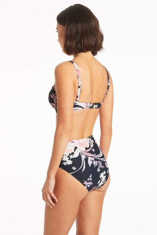 Strut your stuff with confidence in the Martini Twist Front Bandeau Bikini! This sassy two-piece stunner will have you feeling like a million bucks, with its bold garden-inspired florals, flattering cinching around your sides, and removable straps for customizing your look. Trust us: you won’t want to summer without it!    SL3074MR / 4537MR