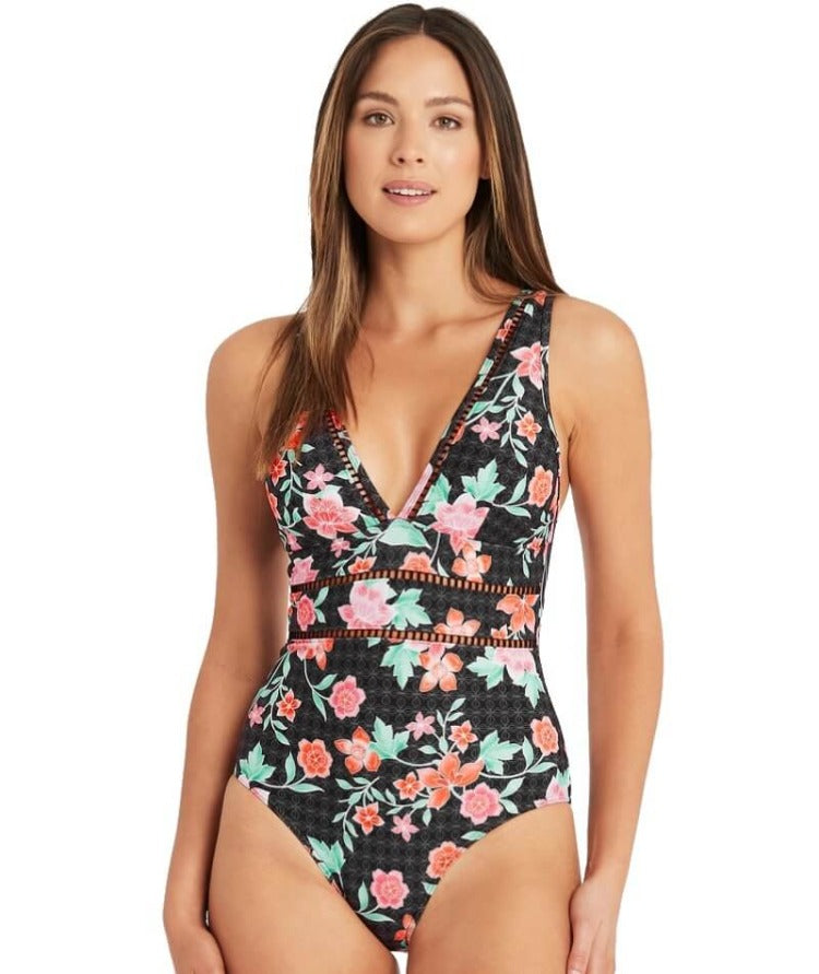 Style your beach days with our Spliced One Piece! This trendy number is designed to stretch your summer wardrobe with its ladder trim and removable soft cups for a custom fit. Plus, it's got your back (and front!) covered with a powermesh lining, so you can feel supported and chic as you soak up the sun! 85% Recycled Nylon, 15% Elastane. Look good and do good!