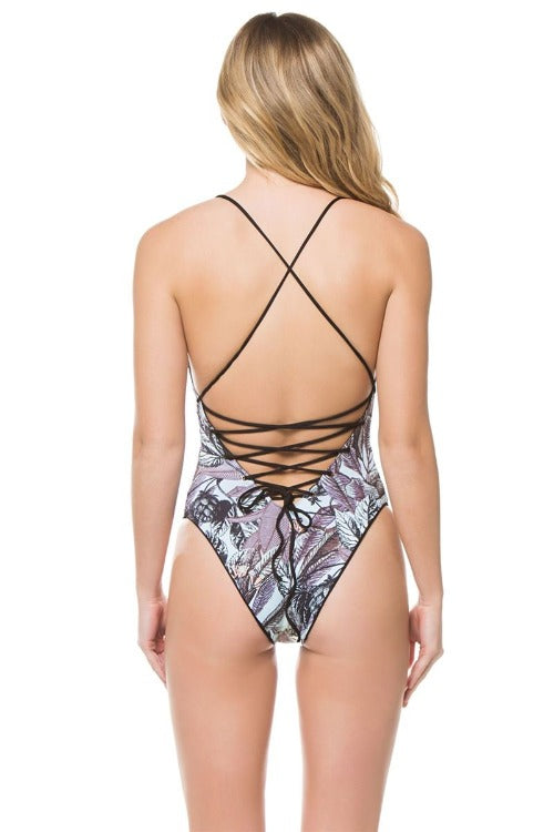 Turn heads with this reversible Meteorite Columbia One Piece! Whether you want some color or you're feeling like a solid gal, it features a skinny tie front (and back!) that adjusts to your perfect fit. And when it's time to show off those curves, the plunging V back and high cut leg give just enough coverage. We call it summer swag for all your beach bops!