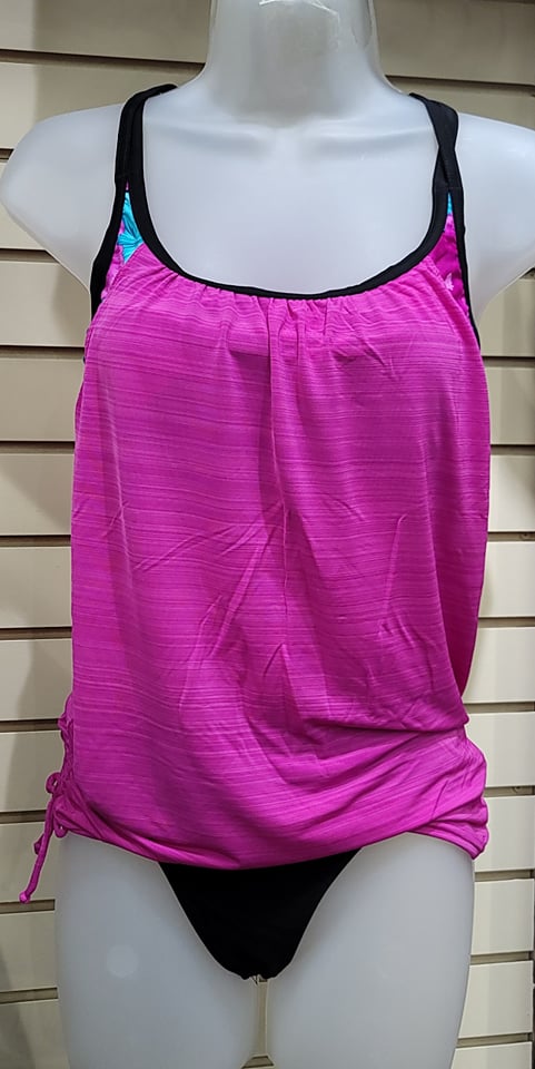 Feel the freedom of the waves in this sassy Sporty Overlay Tankini Set! With a fixed overlay, sport bra-style top, adjustable racer back and split straps, this tankini has everything you need for a confident day in the sun. Its drawstring bodice and unlined fit are perfect for beach days, and its best suited up to a D Cup for a secure and stylish look. Get ready to hit the beach in your new favorite set!      SW411476