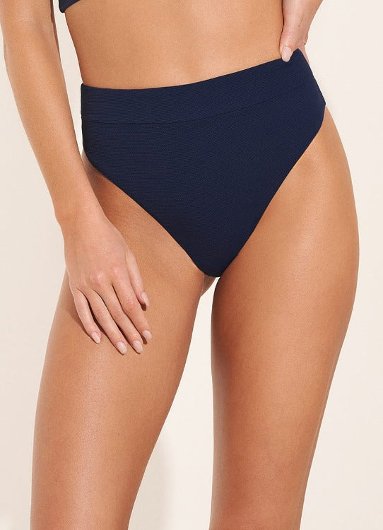 Be prepared to make a splash in the Indigo Blue Danzel D Cup Bikini! This four-way reversible swimsuit offers moderate coverage and adjustable fit with grommets and lace-up front. Plus, removable soft cups, support boning, and special lace toecaps make it the perfect go-to for beach days or pool parties! Colombia made and fully flippable, you'll look and feel great with this stylish swimsuit!