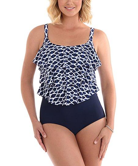 This Penbrooke one piece is sure to turn heads and flatter any figure! Its triple ruffle styling offers the perfect balance – it keeps your curves looking snazzy, yet also shields you from overly revealing swimwear. With fixed straps and a higher backed scoop back, it's sure to keep y'all comfy and confident during your beach day. 