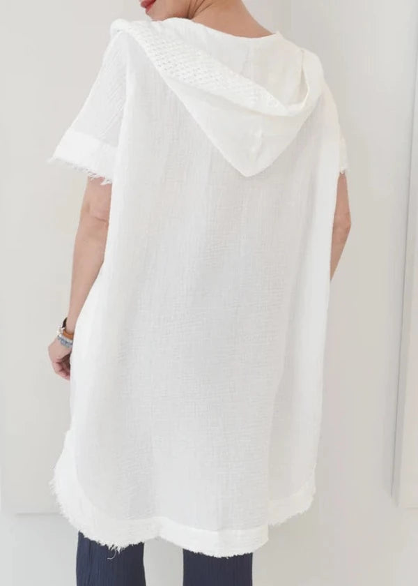 Jet-set in style with the Shannon Passero Haley Poncho – a relaxed, ultra-luxe poncho crafted with 100% hand woven cotton and designed with a hood, hi-lo hem, and distressed edges, for a timelessly chic look. Perfect for any cool-weather ensemble, you'll be ready for whatever your travels bring!    5059