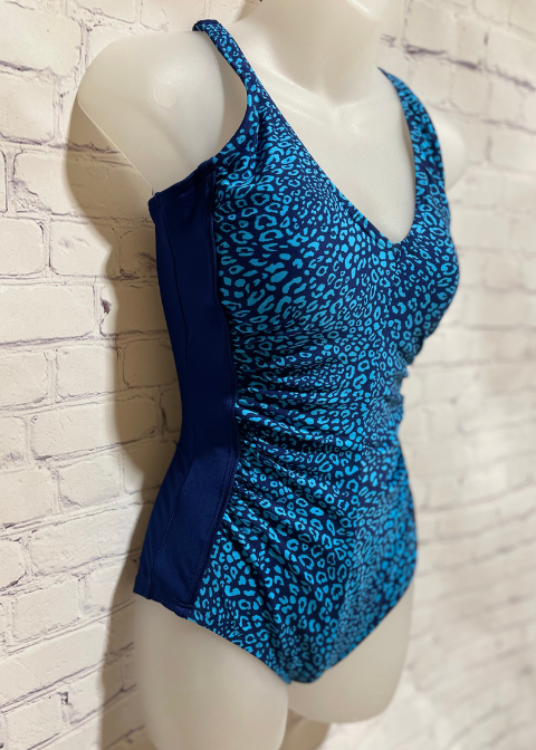 Be the ultimate beach babe in this Gabar swimsuit!  The cheetah-print draped v-neck is not only hot, but the built-in tummy control will have you feeling svelte and confident. Plus, with the stay-put leg, you can frolic away worry-free. Gabar's exclusive Hydrofinity fabric is chlorine-resistant for up to 300+ hours of use, breathable, and offers UPF-50+ protection. Boasting features like tummy control, adjustable straps, and a silicone grip—you can be sure you look your best while having tons of fun!