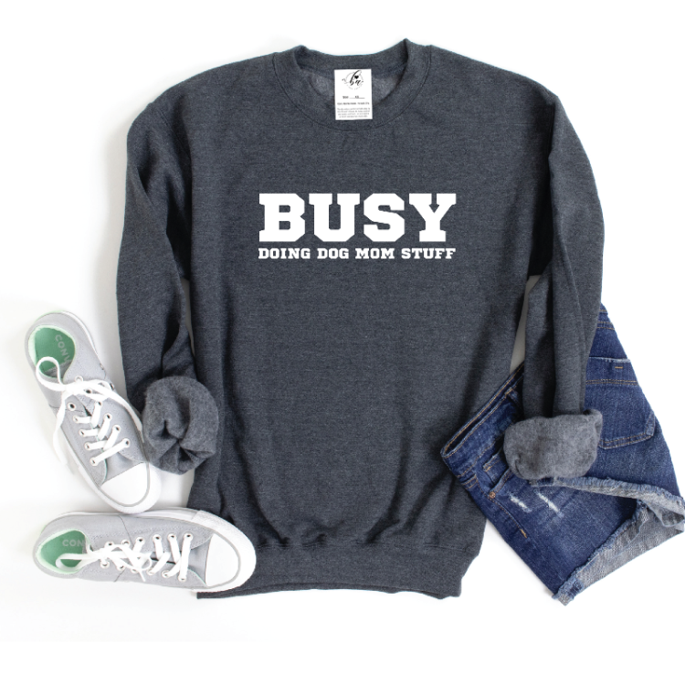 Do your part for a good cause and stay comfy in our Busy Doing Dog Mom Stuff Crew Neck! A portion of proceeds go to charity and it's proudly Canadian designed and printed in Alberta. The cozy 50/50 poly-cotton blend is perfect for a chill day. Pick your size carefully though - they fit generous so size down if you're in between sizes. Wearing it gives you a warm fuzzy feeling inside and out! 🐶❤️