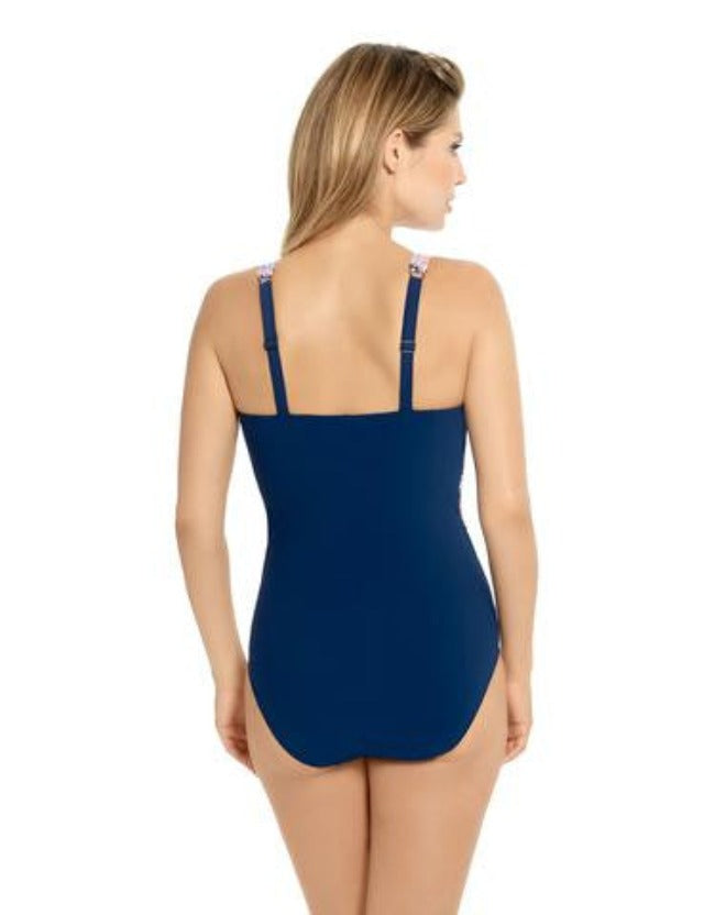 Christina Whimsical Mix Twisted D-Cup One Piece  A unique and highly fashionable swimsuit. Go straight from the beach to the runway in this high end beachwear. Pair it with a sarong and your favorite chardonnay.  (Style # 30WM5017D)  Twisted Front Design  Plunge Neck Line with Mesh Panel  Ruched for Slimming Silhouette Fits up to a D Cup 