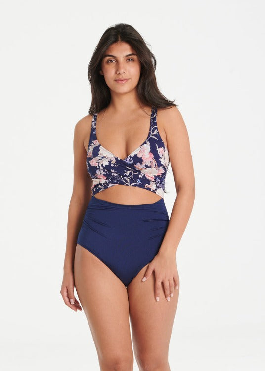 Every Sunday, this iconic best seller wraps you in luxury and confidence! With a design that takes the best of both bikinis and one-pieces, you can own one in every color. Its navy and purple floral print flatters all shapes, while removable cups, inner support, tummy control, and regular coverage offer maximum comfort. Dive into the euphoria of this piece!