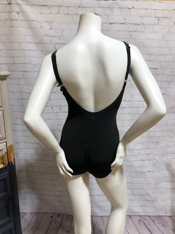 Featuring adjustable straps, built-in shelf bra, and non-removable cups, the Ruched U-Back One Piece offers comfort and practicality. Made of durable, chlorine-resistant and quick-drying polyester, it's designed for colour fastness.