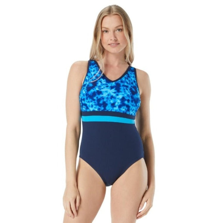 Weave a wave of style into your aquafit routine with the Gabar Women’s Tie Dye V Neck One Piece Swimsuit! Showcasing a dazzling tie dye design on top and a sleek navy on the bottom, the v neckline adds a va-va-voom to your silhouette while the tummy control panel helps you stay trim with confidence. Plus, silicone strips, adjustable straps, and UV 50+ protection offer extra support and protection so you can feel secure in the waves. Quick drying fabric has your back too!