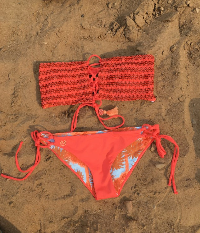 Get the swim style of your dreams with this Maaji Pomelo Bandeau Bikini Set! This reversible two-piece features a corset-style bandeau top and hipster bottoms that can be adjusted for a perfect fit. It also has removable straps and soft pads for extra comfort and support. Sun's out, buns out in this chic, beach-ready set!