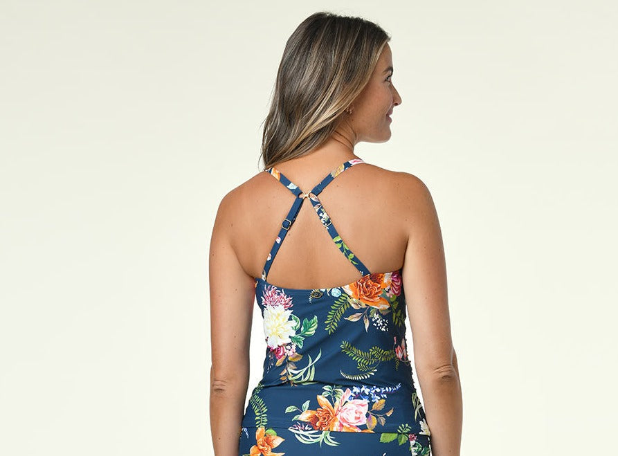 Our Floral Enchantment Cami Tankini Top is a tank-style teatime companion with adjustable straps for customized cozyness and squeezable cups for added structure. The straps are fastened for extra delight and fashionability. Tankini Top Adjustable straps Removable cups UPF 50 Sun Protection Buttery Soft Fabric