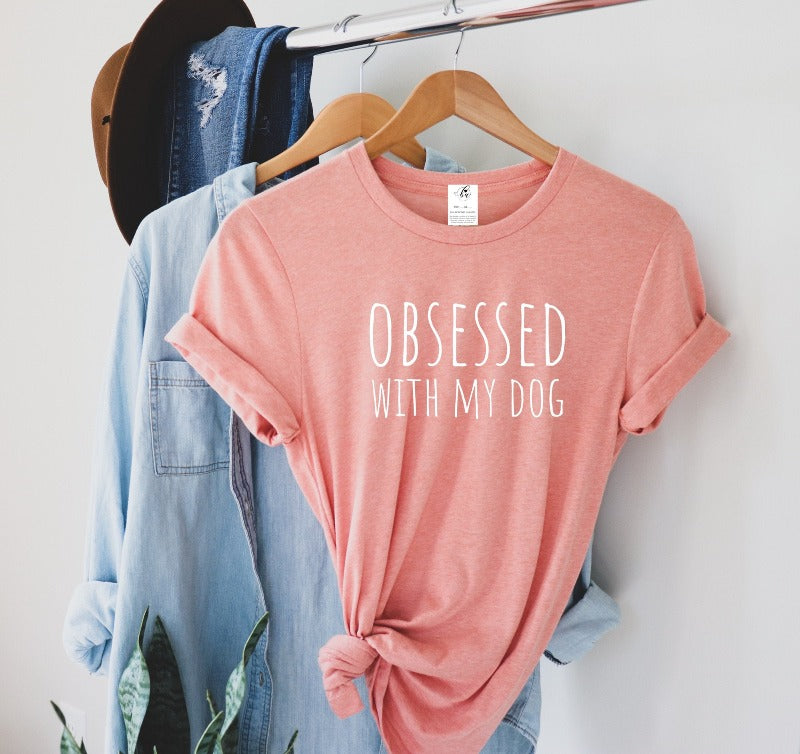 "You and your pup are true soulmates. Let the world know with the Blonde Ambition Obsessed with my dog tee! This roomy, relaxed fit will have you singing (woofing?) your love for your best friend - all day, every day! True to size, this tee is the perfect way to express your 'obsession' - we swear, it's totally okay! 🐶"