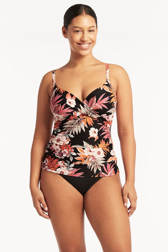 Embrace your curves in this Escape DD/E Cup Twist Front Tankini! This flattering piece offers underwire bra sheath with removable soft cups, so you can make the desired fit for your bust! Best of all, adjustable and convertible straps let you customize this tankini for even more comfort. Boning and powermesh lining give extra front & back support, and the retro high waist bottom is perfect for a fashionably secure fit. Get ready to love life on the beach!     SL3480ES/4140ECO