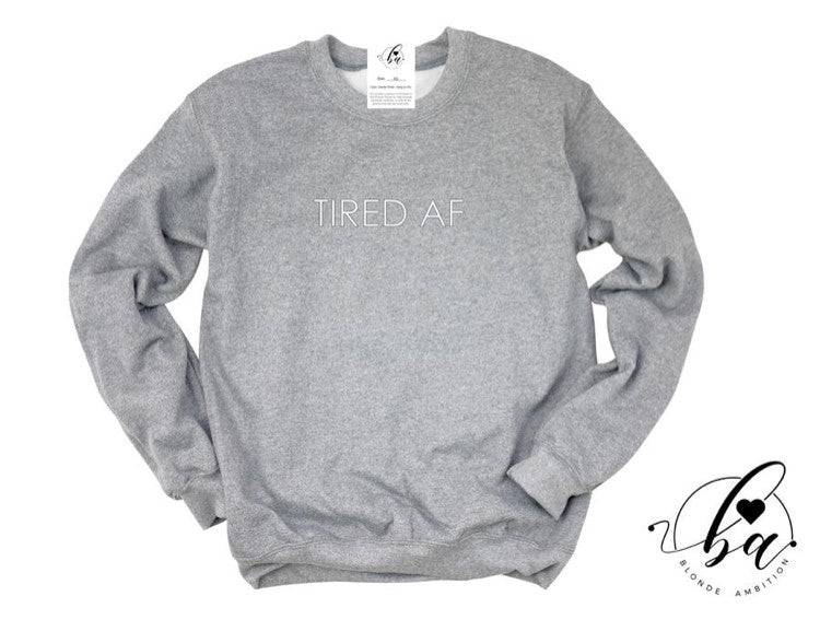 Stay comfy and make a statement in our Blonde Ambition Tired AF Sweater! For the go-getters, the hustlers, the mamas always on the move - this sweater's for you! Show the world you're proud to be Canadian with this locally designed and printed piece, plus know that a portion of your purchase is donated to charity partners fighting against human trafficking and animal abuse. Talk 'bout a fashion-forward mission!