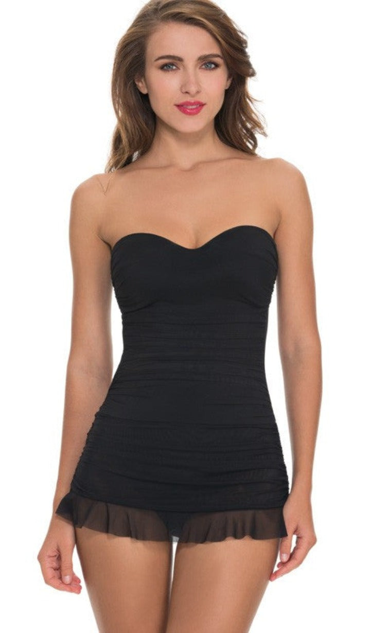 This Bandeau Swim Dress is the perfect beach look to flatter your midsection! Its sheer mesh overlay and ruffle skirted detail give you a feminine feel, while the removable and adjustable over the shoulder straps keep you secure. With soft foam cups and full coverage bottom, you'll be ready to make waves!