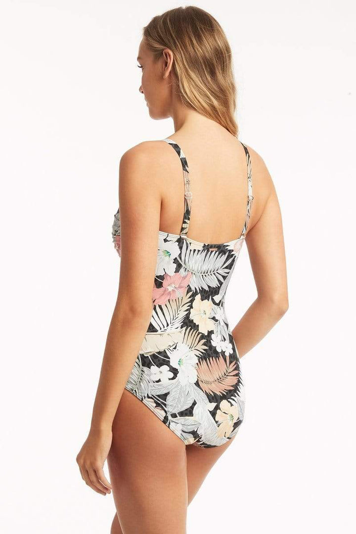 Calypso Twist Bandeau One Piece Style # SL1586CL  The Waikiki-inspired florals of our Calypso collection enjoy a modern and joyous take. From fun and flirty bikinis to our ultra-flattering one-pieces, no matter your swim shape of choice, you'll find the fit that's it. This flattering suit offers a gathered overlay. 
