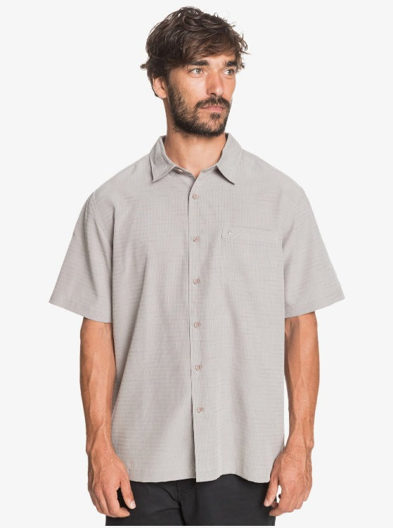 Take a trip into cool comfort with our Centinela Short Sleeve Button Up! Made with wrinkle and sweat-resistant polynosic polyester fabric, this shirt takes your travel style up a notch with its sand-washed texture, moisture-wicking technology, and pick-edge stitching. Plus, its slouchy fit and contrasted inner yoke panel give your wardrobe a bleached-out edge—we guarantee you’ll look (and feel!) super fly!     EQMWT03150