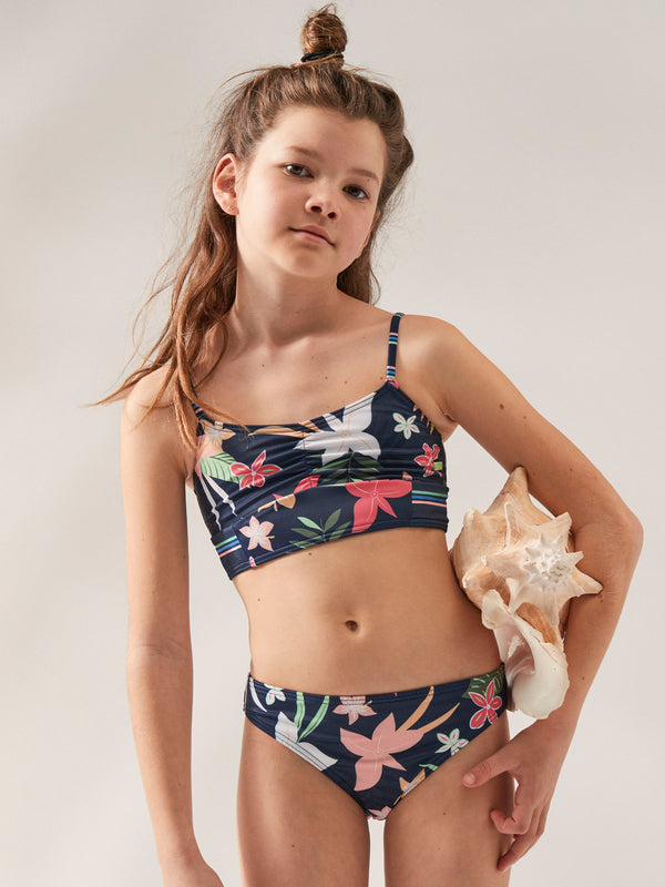 Send your girl on an adventure of style with the Roxy Vacay Life Crop Top Two Piece Bikini Set! Perfect for beach days and seaside fun, this navy, floral, and striped two-piece is made of chlorine-resistant recycled fabric that stretches with her energy. Plus, she'll feel extra secure with fixed straps, cups (12-16 yrs), and full coverage. Let the vacay begin!    ERGX203490