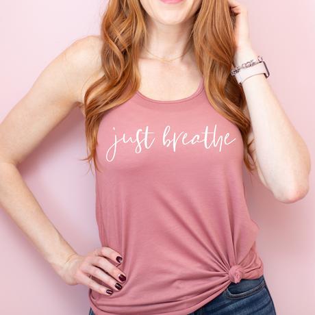 Our Just Breathe Racer Back Tank Top is the everyday essential you'll want in your wardrobe! Boasting a cool, flowy fit and a racerback style, you'll be as comfy as can be, but still look fly. So don't sweat it - just breathe!