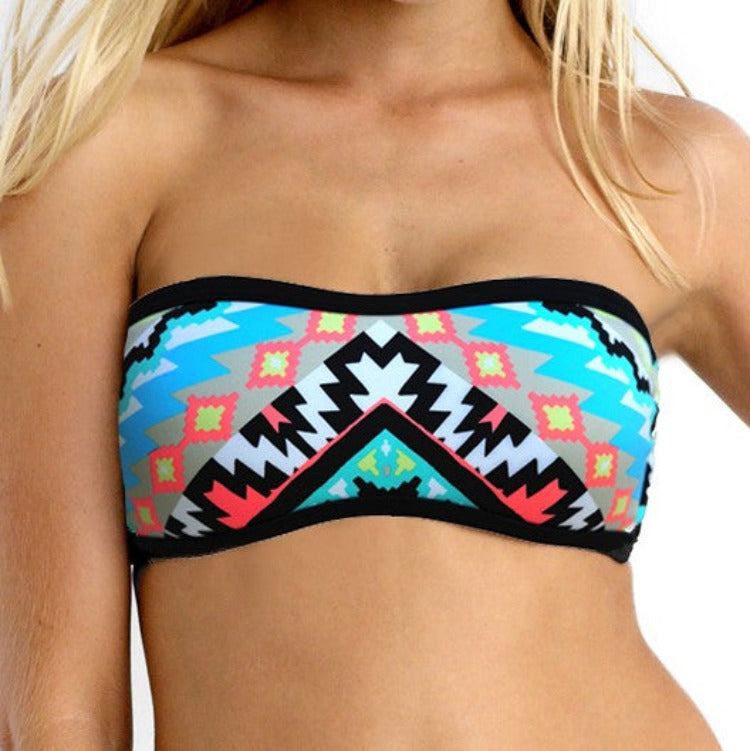 This Seafolly Kasbah Scuba Bandeau Set features a strapless bandeau top crafted from a luxurious polyester/elastane blend fabric. It fits A-C cup sizes, with soft removable cups and boning for shape and support. Contrast binding and an optional halter strap add to the design. The Clip back closure provides a secure fit. The Scuba-Luxe Hipster Bottom has a low-rise, cheeky coverage silhouette, made from a blend of nylon and elastane.    30561221/4030922