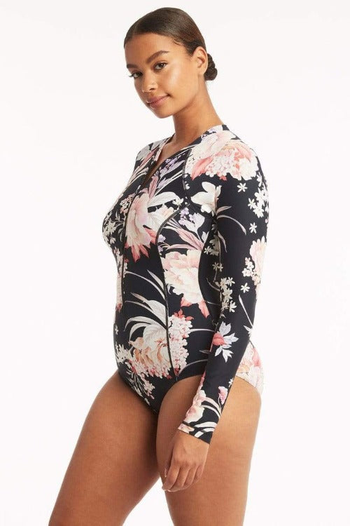  Make a splash in our Martini One Piece! Our floral mix of Khaki and Black will turn heads as you surf the waves. It's fully equipped with all the right features - zip-up front, removable soft cups, UPF 50+ protection, and flattering high legs - for a sassy look while you stay safe. Dive into Summer in style!    SL1112MR