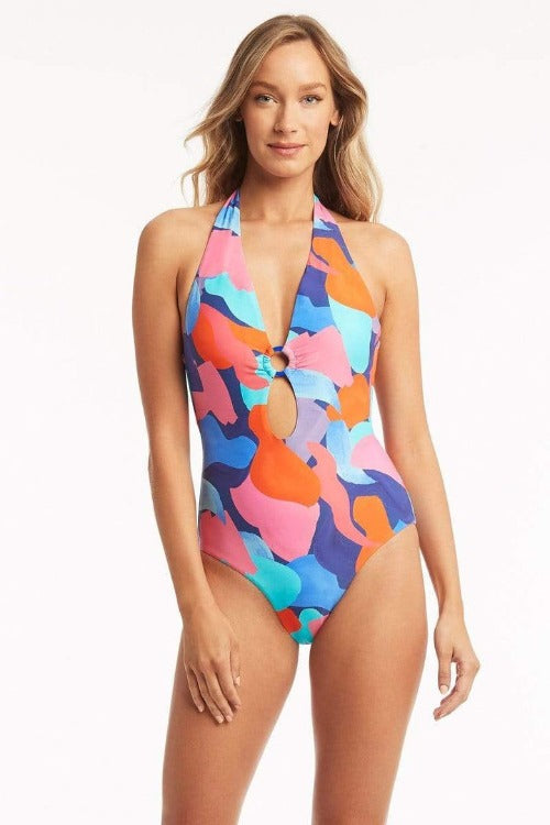 Escape to a tropical paradise in this Royal Painted Keyhole Halter One Piece from Sea Level! Hand painted in a bright and beautiful mix of blues, pinks, and corals, it's got 90's vibes with a modern twist. Plus, with soft cup support, halter tie straps, and Powermesh support, this one-piece is designed to flatter and show off your backside! Perfect for A-C cup sizes, it's an absolute must-have for your next beach day!    SL1587PB