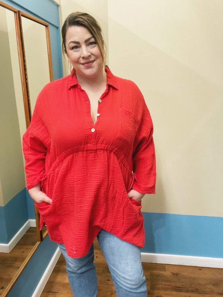 Look rad in the Shannon Passero Vina Top! This oversized, long-sleeve top features a half button closure, a convertible drawstring waist tie and pockets - a gal's gotta have her pockets. Throw it on over jeans or leggings for an effortless, yet chic look. BAM. Done!    5065
