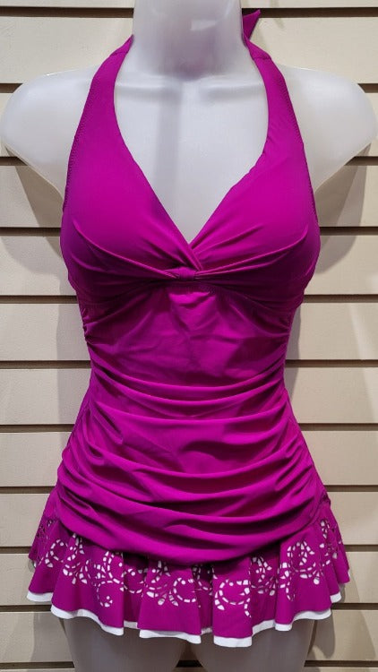 Turn heads with the Profile Enchantment Halter Swimdress One Piece! It's the just-right combo of fit, style, and tummy control to keep you looking fierce. Boasting a laser-cut skirt, torso shirring and halter styling, this is sure to be your go-to for all your beach and poolside activities. Plus, it's constructed with soft cups, tummy control, and a tie closure - what's not to love? Psst--Size up for optimal fit!    E732-2001, E6222001